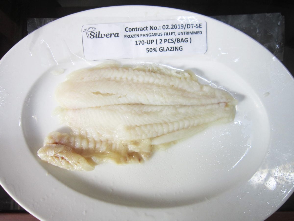 Checking Flavor Of A Cooked Pangasius Untrimmed Fillet